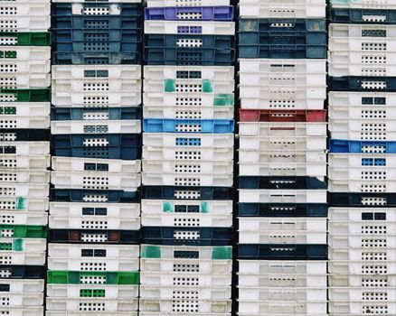 Colorful rows of plastic crates stacked neatly in Konaev, Almaty Region.