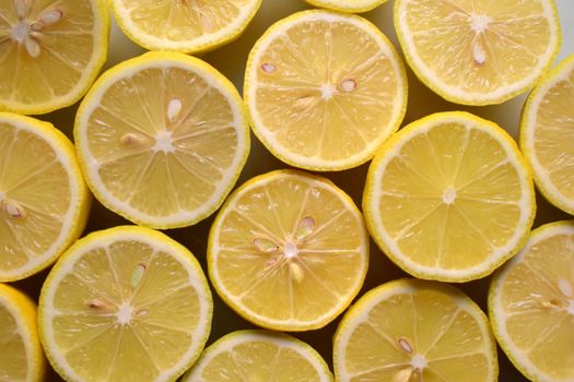 Close-up of vibrant lemon halves showcasing their juicy pulp and refreshing texture.