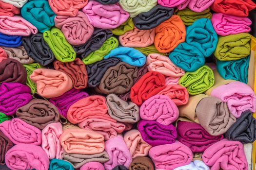 Sodium Bicar Vibrant rolled fabrics in various colors, showcasing textile diversity and market choices.