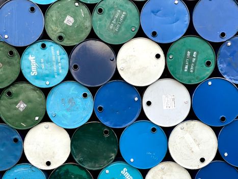 PIGMENT BLUE 29 Aerial view of stacked colorful barrels in Myanmar, showcasing industrial design.